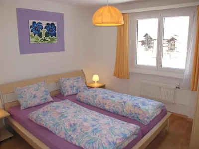 Ein Bett oder Betten in einem Zimmer der Unterkunft Aurora Appartement WEISSMIES by FeWo-PLAN SAAS232