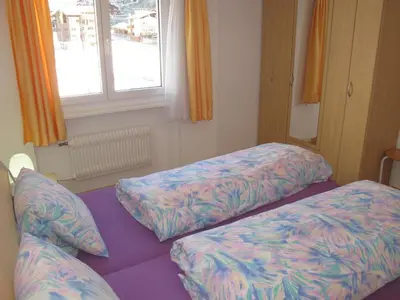 Ein Bett oder Betten in einem Zimmer der Unterkunft Aurora Appartement WEISSMIES by FeWo-PLAN SAAS232