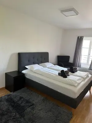 Ein Bett oder Betten in einem Zimmer der Unterkunft Interlaken Best View Deluxe Apartment
