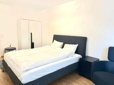 Ein Bett oder Betten in einem Zimmer der Unterkunft Interlaken Best View Deluxe Apartment