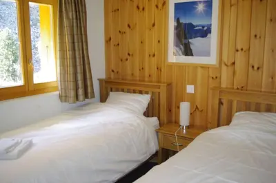 Ein Bett oder Betten in einem Zimmer der Unterkunft Chalet Mille Étoiles