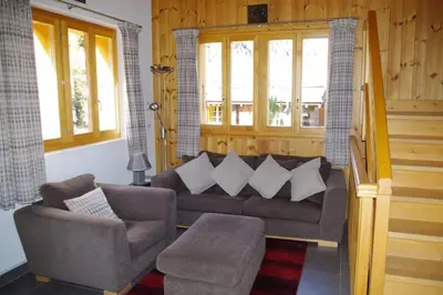 Ein Sitzbereich in der Unterkunft Chalet Mille Étoiles