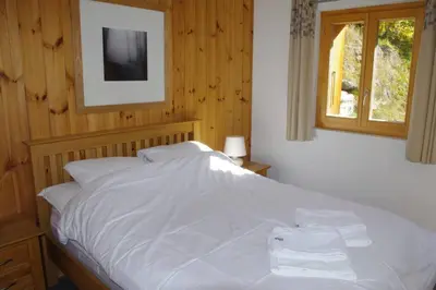 Ein Bett oder Betten in einem Zimmer der Unterkunft Chalet Mille Étoiles