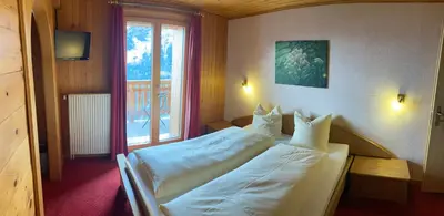 Ein Bett oder Betten in einem Zimmer der Unterkunft Haus Rhodania