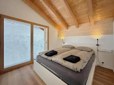Ein Bett oder Betten in einem Zimmer der Unterkunft Chalet Commaraf! - Swiss Alp 4 Vallees