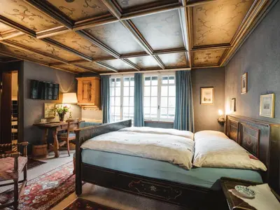 Ein Bett oder Betten in einem Zimmer der Unterkunft Apartment Chalet Turquino - Apartment Adlerhorst by Interhome