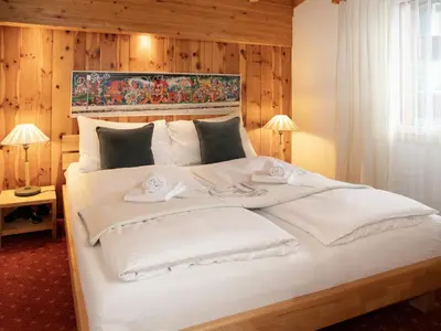 Ein Bett oder Betten in einem Zimmer der Unterkunft Apartment Chalet Abendrot apARTments-19 by Interhome