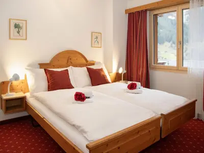 Ein Bett oder Betten in einem Zimmer der Unterkunft Apartment Chalet Abendrot apARTments-21 by Interhome