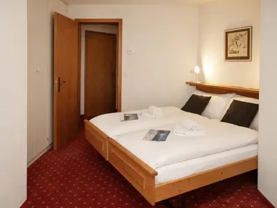 Ein Bett oder Betten in einem Zimmer der Unterkunft Apartment Chalet Abendrot apARTments-25 by Interhome