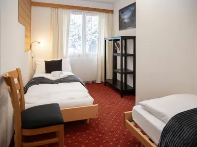 Ein Bett oder Betten in einem Zimmer der Unterkunft Apartment Chalet Abendrot apARTments-28 by Interhome