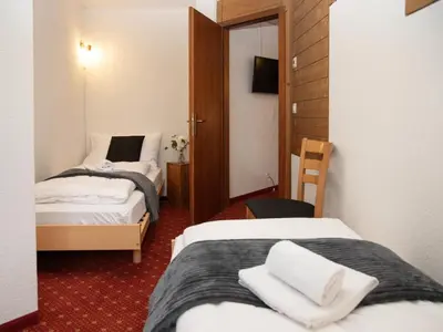 Ein Bett oder Betten in einem Zimmer der Unterkunft Apartment Chalet Abendrot apARTments-28 by Interhome