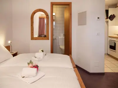 Ein Bett oder Betten in einem Zimmer der Unterkunft Apartment Chalet Abendrot apARTments-3 by Interhome