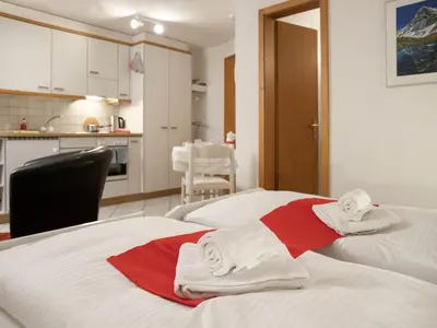 Ein Bett oder Betten in einem Zimmer der Unterkunft Apartment Chalet Abendrot apARTments-6 by Interhome