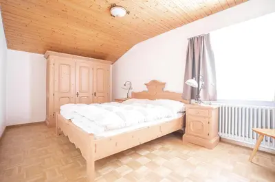 Ein Bett oder Betten in einem Zimmer der Unterkunft Valaisia 49