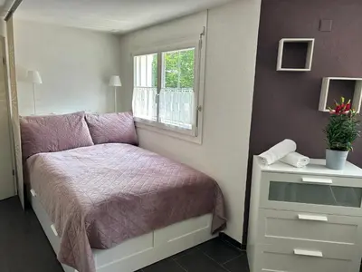 Ein Bett oder Betten in einem Zimmer der Unterkunft Studio Inferno Lauterbrunnen