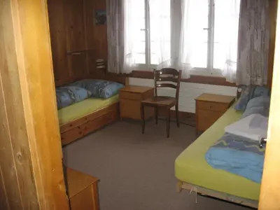 Ein Bett oder Betten in einem Zimmer der Unterkunft Chalet uf em Stutz 1