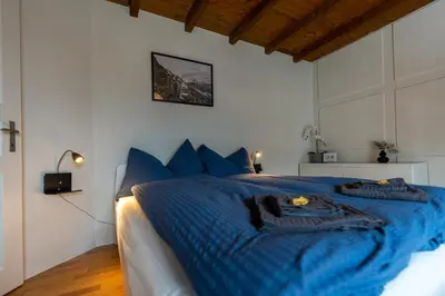 Ein Bett oder Betten in einem Zimmer der Unterkunft Jungfrau-View Apartment, terrace & free parking
