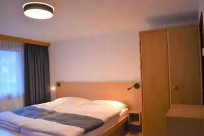 Ein Bett oder Betten in einem Zimmer der Unterkunft Appartementhaus Crystal
