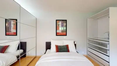 Ein Bett oder Betten in einem Zimmer der Unterkunft Spacious studio in a quiet area of Sierre