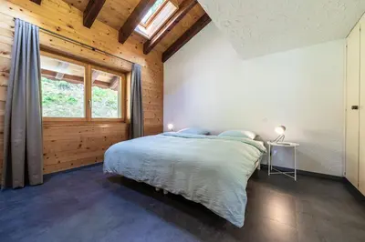 Ein Bett oder Betten in einem Zimmer der Unterkunft Mirador auf der Sonnenterrasse von Saas-Fee