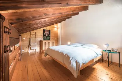 Ein Bett oder Betten in einem Zimmer der Unterkunft Mirador auf der Sonnenterrasse von Saas-Fee