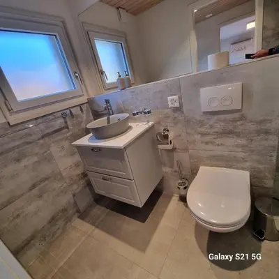 Ein Badezimmer in der Unterkunft Mountain - Lake Apartment 3