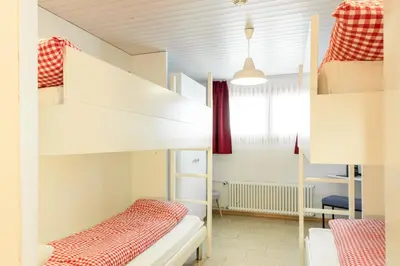 Ein Bett oder Betten in einem Zimmer der Unterkunft Berghotel Distelboden