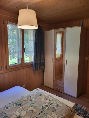 Ein Bett oder Betten in einem Zimmer der Unterkunft Gemütliches Chalet