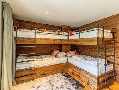 Ein Bett oder Betten in einem Zimmer der Unterkunft Sonnhalde II - Luxury Chalet