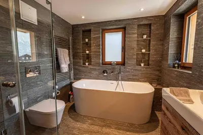 Ein Badezimmer in der Unterkunft Sonnhalde II - Luxury Chalet