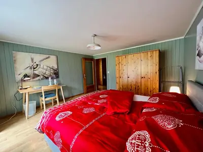 Ein Bett oder Betten in einem Zimmer der Unterkunft ”Heimet” im Berner Oberland