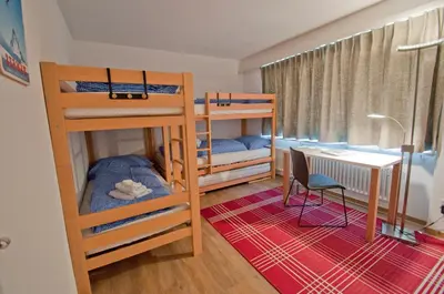 Ein Bett oder Betten in einem Zimmer der Unterkunft Haus Matten, Apartment Breithorn