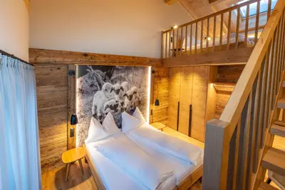 Ein Bett oder Betten in einem Zimmer der Unterkunft Mountain Lodge