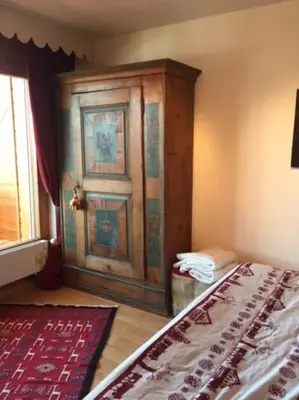 Ein Bett oder Betten in einem Zimmer der Unterkunft La casetta di Crans