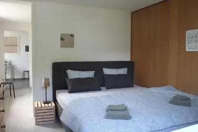 Ein Bett oder Betten in einem Zimmer der Unterkunft NEB-THUN Studio am Thunersee