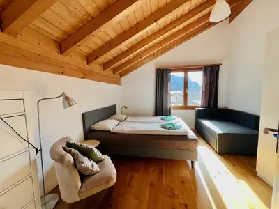 Ein Bett oder Betten in einem Zimmer der Unterkunft Maisonette 4.5 Zimmer, Nähe Ballenberg
