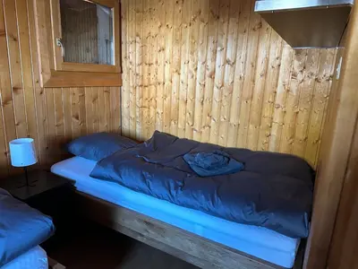 Ein Bett oder Betten in einem Zimmer der Unterkunft Chalet Edelweiss à Saint-Martin, Val d'Hérens