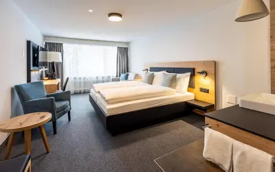 Ein Bett oder Betten in einem Zimmer der Unterkunft Hotel Piz Badus
