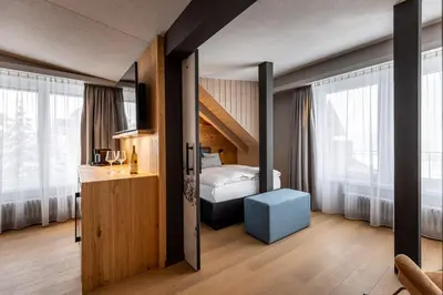 Ein Bett oder Betten in einem Zimmer der Unterkunft Hotel Piz Badus