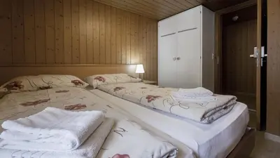 Ein Bett oder Betten in einem Zimmer der Unterkunft Rössli Holiday Apartment