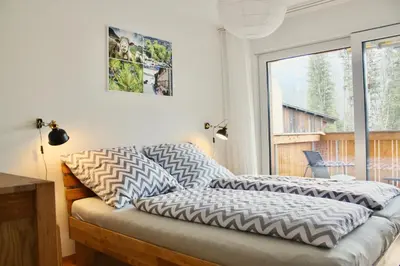 Ein Bett oder Betten in einem Zimmer der Unterkunft Apartment Arvenwald