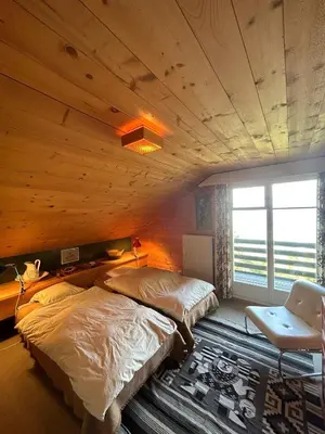 Ein Bett oder Betten in einem Zimmer der Unterkunft Cache-Cache MOUNTAIN & QUIET chalet 10 pers