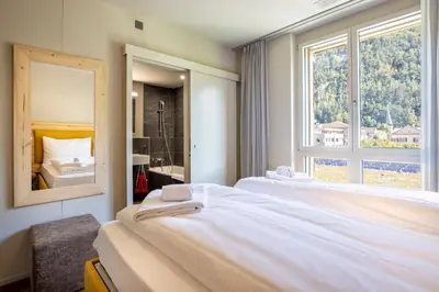 Ein Bett oder Betten in einem Zimmer der Unterkunft SWISSPEAK Resorts by Pierre & Vacances Premium Meiringen