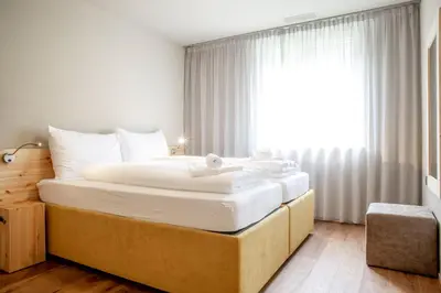 Ein Bett oder Betten in einem Zimmer der Unterkunft SWISSPEAK Resorts by Pierre & Vacances Premium Meiringen