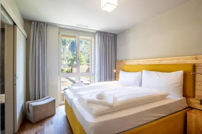 Ein Bett oder Betten in einem Zimmer der Unterkunft SWISSPEAK Resorts by Pierre & Vacances Premium Meiringen