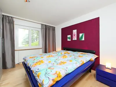 Ein Bett oder Betten in einem Zimmer der Unterkunft Apartment Sonnhalde B by Interhome