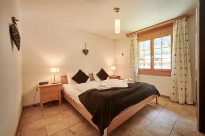 Ein Bett oder Betten in einem Zimmer der Unterkunft Apartment Silberhorn, outstanding view, spacious, family friendly