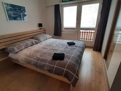 Ein Bett oder Betten in einem Zimmer der Unterkunft Apartment Alpin Smile by Interhome