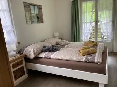 Ein Bett oder Betten in einem Zimmer der Unterkunft Apartment Hubertus 396 d by Interhome