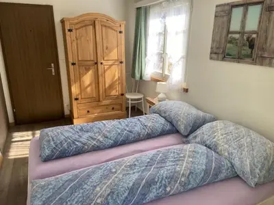 Ein Bett oder Betten in einem Zimmer der Unterkunft Apartment Hubertus 396 d by Interhome